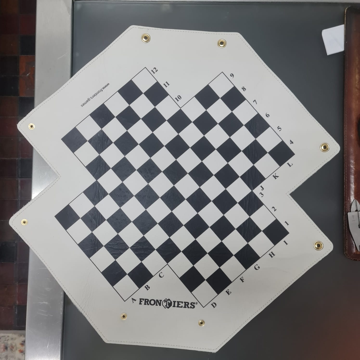 White leather FRONTIERS board unfolded during product development.